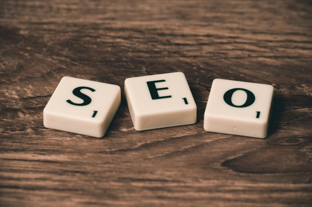 pexels photo 270637 270637 Scrabble tiles spelling 'SEO' on a wooden surface. Ideal for digital marketing themes.